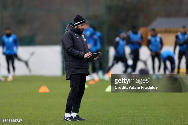 Damia Abella Statistical Analyst of West Bromwich Albion uses a tablet / iPad during a first team training session at West Bromwich Albion Training...