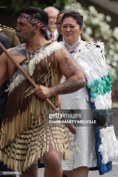 New Zealand Governor General Dame Cindy Kiro is escorted by a Maori warrior from a welcoming party for the re-starting of Parliament following the...