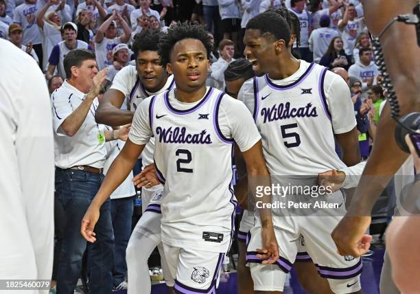 Tylor Perry of the Kansas State Wildcats celebrates with teammate Cam Carter after hitting the game winning three-point shot against the Villanova...