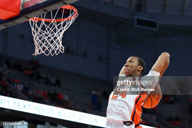 Quadir Copeland of the Syracuse Orange drives for a dunk against the Cornell Big Red during the second half at the JMA Wireless Dome on December 5,...