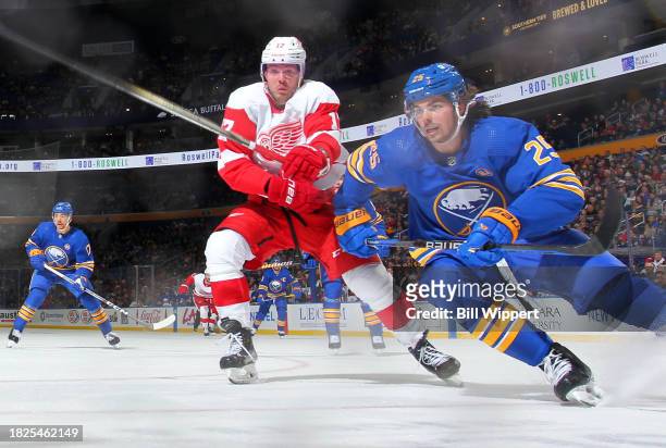 Owen Power of the Buffalo Sabres skates against Daniel Sprong of the Detroit Red Wings during an NHL game on December 5, 2023 at KeyBank Center in...