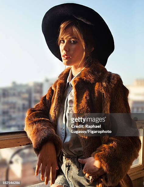 Singer Lou Lesage is photographed for Madame Figaro on July 19, 2013 in Paris, France. Coat , shirt , shorts , hat , earrings , ring . CREDIT MUST...