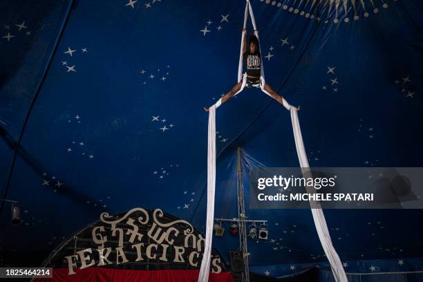 Fekat Circus artist Emnet Elias trains in aerial skills before the circus weekend show in Bishoftu on December 3, 2023. Nested in a steep cobbled...