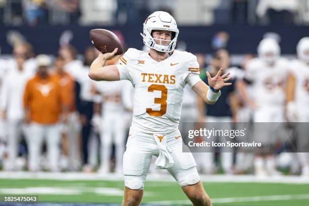 Texas Longhorns quarterback Quinn Ewers throws a pass during the Big 12 Championship football game between the Texas Longhorns and Oklahoma State...