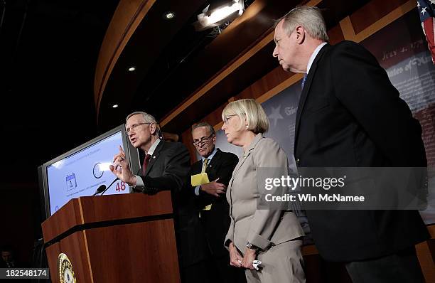 Senate Majority Leader Harry Reid speaks at a press conference after the Senate voted to table House legislation to avert a government shutdown by...