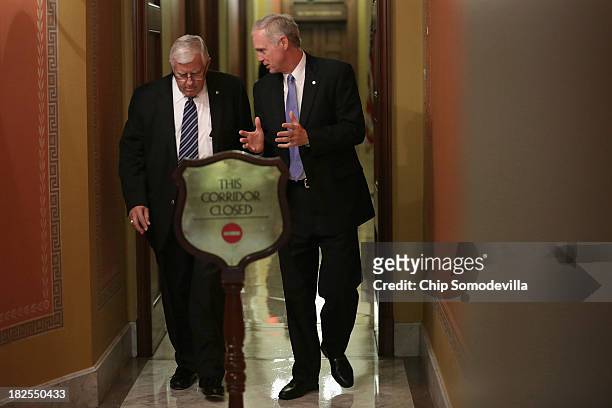 Sen. Mike Enzi and Sen. Ron Johnson leave a Republican Senate caucus meeting at the U.S. Capitol September 30, 2013 in Washington, DC. If House...