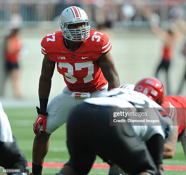 Linebacker Joshua Perry of the Ohio State Buckeyes waits for the snap of the football during a game against the San Diego State Aztecs at Ohio...