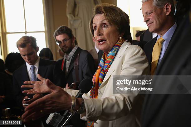 House Minority Leader Rep. Nancy Pelosi speaks as Rep. Steve Israel listens during a news conference after a House Democratic leadership meeting...