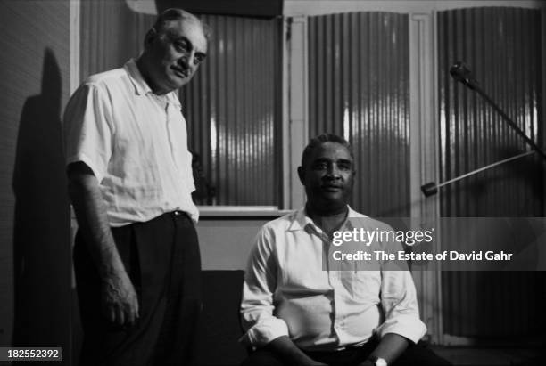 Folkways Records founder Moe Asch and blues, jazz, and boogie woogie pianist Eurreal Wilford "Little Brother" Montgomery pose for a portrait in the...
