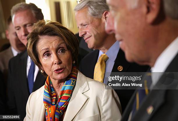 House Minority Leader Rep. Nancy Pelosi speaks as Rep. Chris Van Hollen , Rep. Steve Israel , and House Minority Whip Rep. Steny Hoyer listen during...