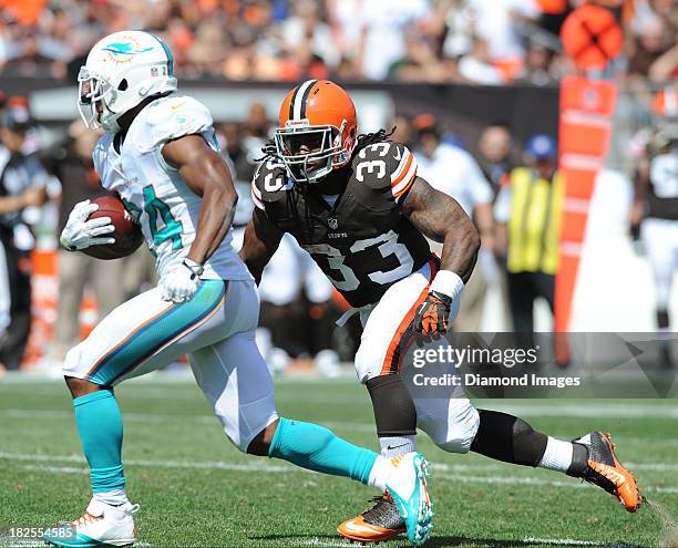 Running back Trent Richardson of the Cleveland Browns chases defensive back Dimitri Patterson of the Miami Dolphins after a interception by Patterson...