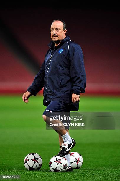 Napoli's Spanish coach Rafael Benitez takes part in a training session at the Emirates Stadium, North London, on September 30, 2013 on the eve of the...