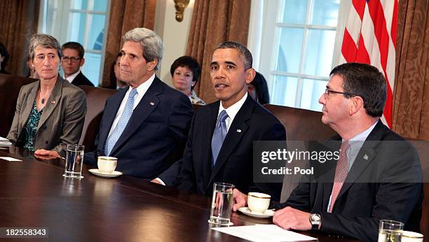 President Barack Obama presides over a cabinet meeting to discuss the possible government shutdown at the White House on September 30, 2013 in...