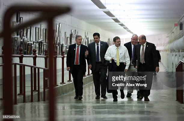 Members of U.S. House of Representatives, including Rep. Jim Jordan , walk in the Cannon Tunnel on their way for a procedural vote at the House...