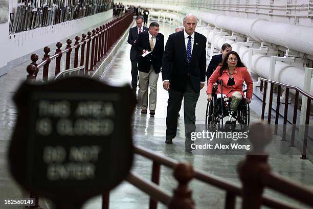 Members of U.S. House of Representatives, including Rep. Tammy Duckworth , travel in the Cannon Tunnel on their way for a procedural vote at the...