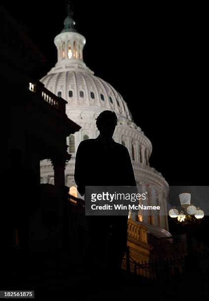 Members of the House of Representatives leave the U.S. Capitol after passing a continuing resolution to fund the U.S. Government that would also...