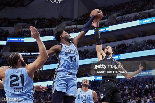 Jaren Jackson Jr. #13 of the Memphis Grizzlies blocks the shot of Josh Green of the Dallas Mavericks in the first half at American Airlines Center on...