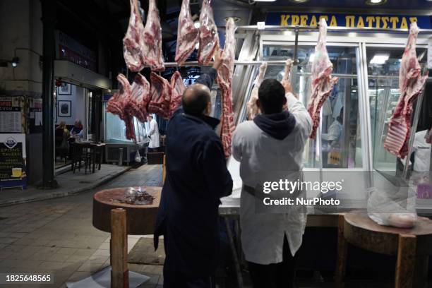 Butchers are working in the Varvakios flea market in Athens, Greece, on May 12, 2023.