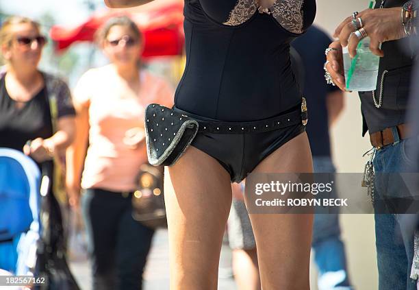 By Fabienne Faur, Lifestyle-food-US-health-teenagers A woman in costume poses for tourists on Hollywood Boulevard in Hollywood, California, on...