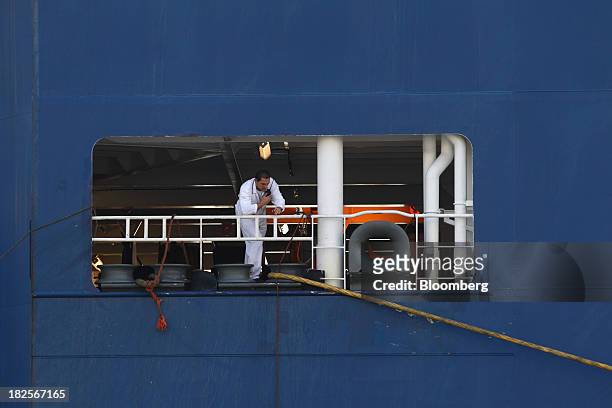 Worker uses a handheld transceiver inside a Nippon Yusen Kaisha roll-on/roll-off vehicle cargo ship at the port of Pyeongtaek in Pyeongtaek, South...