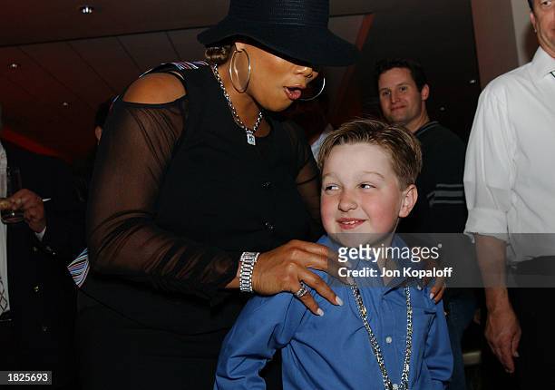 Actress/producer/recording artist Queen Latifah and actor Angus T. Jones attend the premiere after-party of "Bringing Down The House" at Hollywood &...