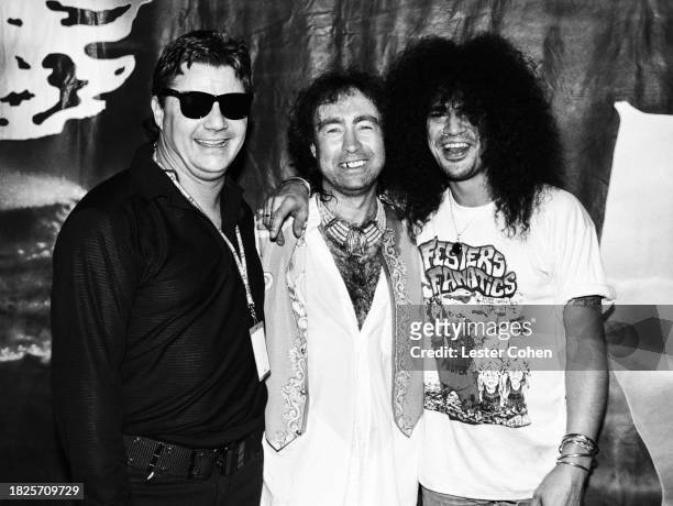 American musician Steve Miller, of the Steve Miller Band, English musicians Paul Rodgers, of Bad Company, and Slash, of Guns N' Roses, pose for a...