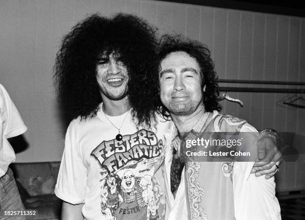 English musicians Slash, of Guns N' Roses, and Paul Rodgers, of Bad Company, pose for a portrait at an event in Los Angeles, California, circa 1990.