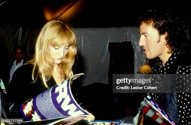 American singer Bruce Springsteen and his wife Patti Scialfa stand backstage during The Rolling Stones concert at the Los Angeles Memorial Coliseum...