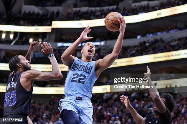 Desmond Bane of the Memphis Grizzlies drives to the basket against Derrick Jones Jr. #55 of the Dallas Mavericks in the second half at American...