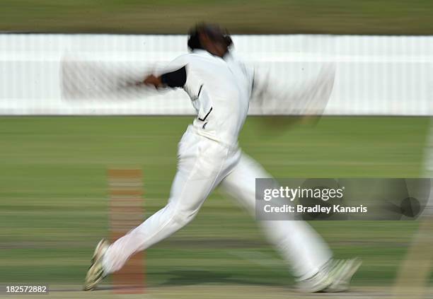 Solomon Mire of Victoria bowls during day two of the Futures League match between Queensland and Victoria at Allan Border Field on October 1, 2013 in...