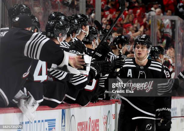 Jack Hughes of the New Jersey Devils is congratulated by teammates after he scored during the third period against the San Jose Sharks at Prudential...