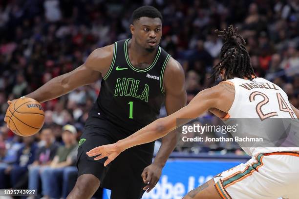 Zion Williamson of the New Orleans Pelicans drives against Devin Vassell of the San Antonio Spurs during the second half at the Smoothie King Center...