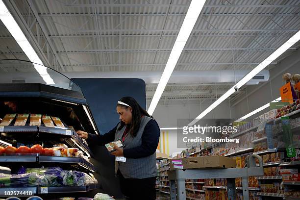 Walgreen Co. Assistant Store Manager Tammy Jenkins stocks sandwiches at one of the company's stores in Louisville, Kentucky, U.S., on Monday, Sept....