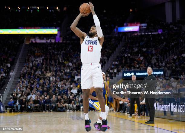 Paul George of the LA Clippers shoots a three-point shot against the Golden State Warriors during the second half of an NBA basketball game at Chase...