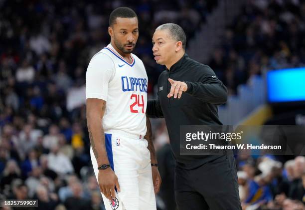 Head coach Tyronn Lue of the LA Clippers talks with his player Norman Powell during a break in the action against the Golden State Warriors in the...