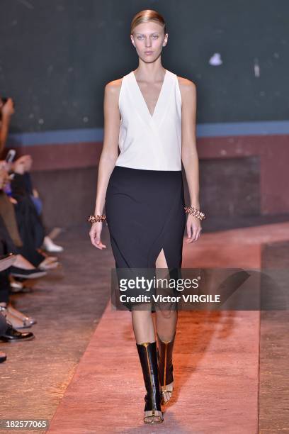 Model walks the runway during Cedric Charlier show as part of the Paris Fashion Week Womenswear Spring/Summer 2014 on September 24, 2013 in Paris,...