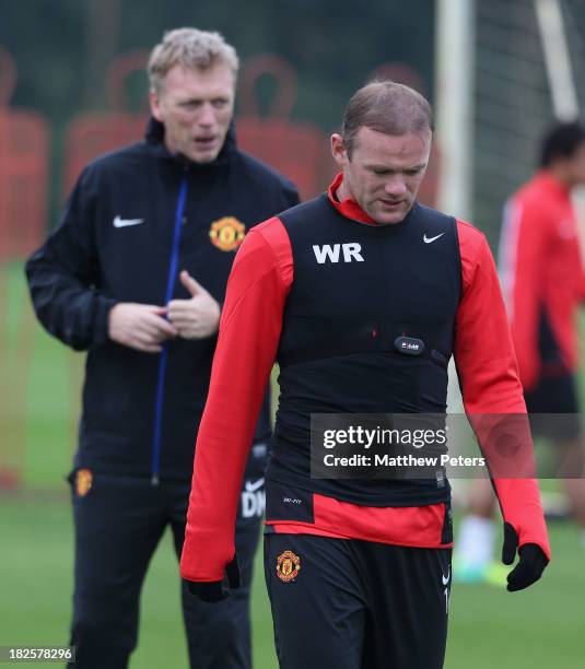 Wayne Rooney and Manager David Moyes of Manchester United in action during a first team training session, ahead of their UEFA Champions League match...