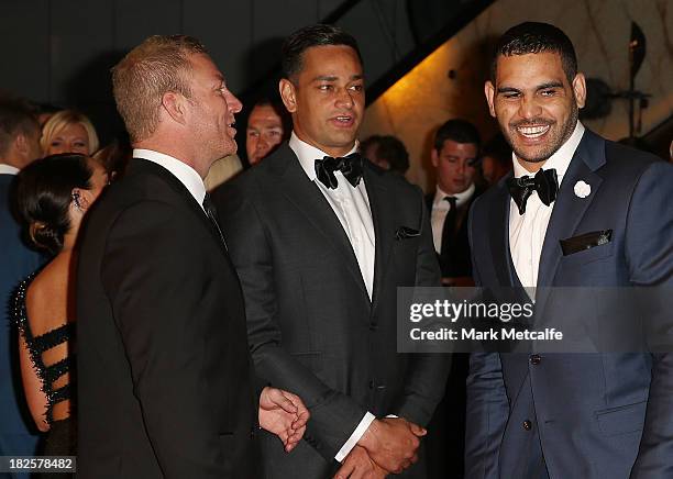 Greg Inglis smiles with Michael Crocker and John Sutton on arrival ahead of the 2013 Dally M Awards at Star City on October 1, 2013 in Sydney,...