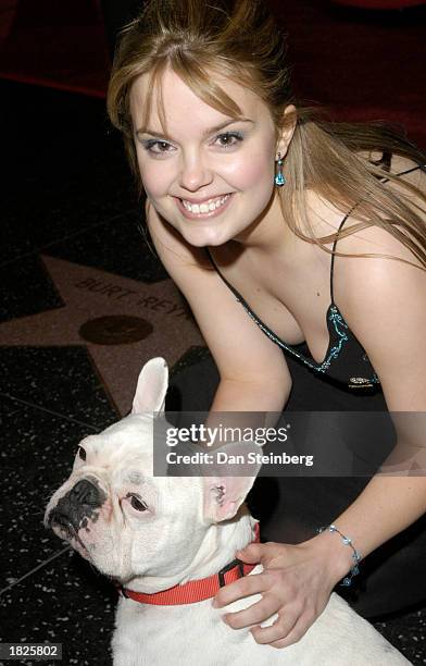 Actress Kimberly J. Brown and Animal Actor Linus arrive at the premiere of their movie "Bringing Down The House" on March 2, 2003 in Los Angeles,...