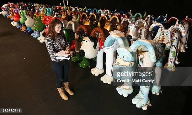 Dani Marlborough from Gromit Unleashed walks among the giant Gromit sculptures that have been decorated by artists & celebrities, as they wait in a...