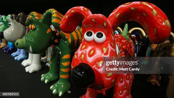 Some of the giant Gromit sculptures that have been decorated by artists & celebrities, are seen as they wait in a secret location, before being...