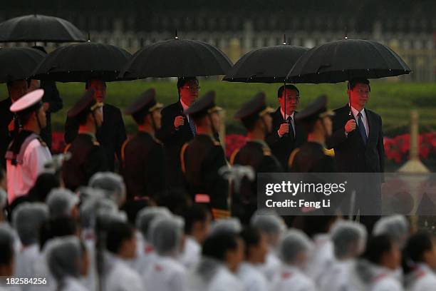 Chinese President Xi Jinping, Premier Li Keqiang, members of the Politburo Standing Committee Zhang Dejiang, Yu Zhengsheng and Liu Yunshan hold...