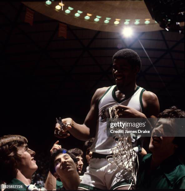 Ervin 'Magic' Johnson of the Michigan State Spartans cuts the net down after the teams 75-64 win over the Indiana State Sycamores in the NCAA Men's...