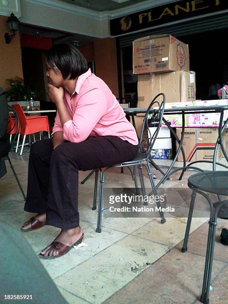 Supplier sits inside a shop at Westgate mall on September 30, 2013 in Nairobi, Kenya. The Mall was hit with a terrorist attack on September 21, 2013....