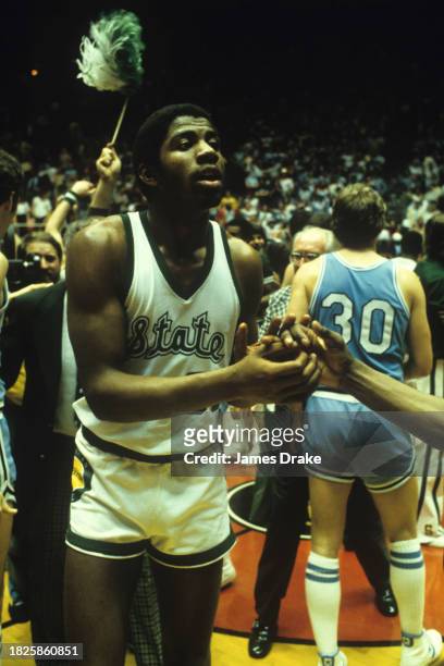 Ervin 'Magic' Johnson of the Michigan State Spartans celebrates the teams 75-64 win over the Indiana State Sycamores in the NCAA Men's Basketball...
