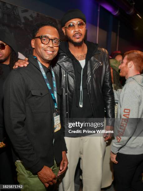 Girard Hardy and Carmelo Anthony attend Overtime Elite Arena Opening Night at Overtime Elite Arena on December 1, 2023 in Atlanta, Georgia.