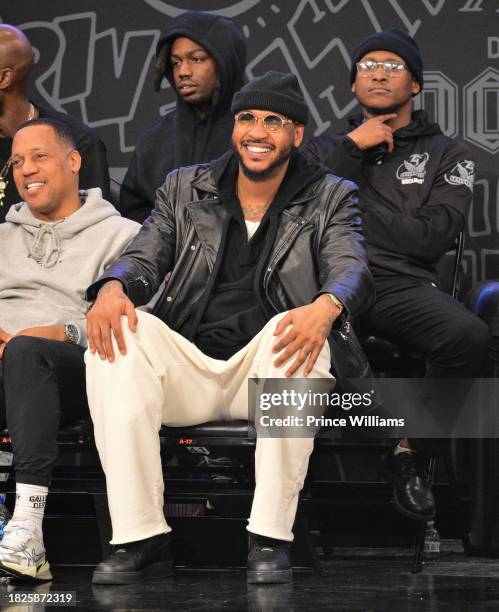 Carmelo Anthony Sits Court side during Overtime Elite Arena Opening Night at Overtime Elite Arena on December 1, 2023 in Atlanta, Georgia.