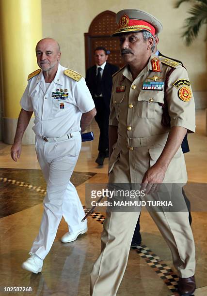 Libyan Army Chief of Staff, Colonel Abdessalem Jadallah al-Salihin walks with his Italian counterpart Admiral Luigi Binelli Mantelli in the Libyan...