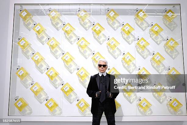 Fashion designer Karl Lagerfeld poses in front of his works before the Chanel show as part of the Paris Fashion Week Womenswear Spring/Summer 2014,...