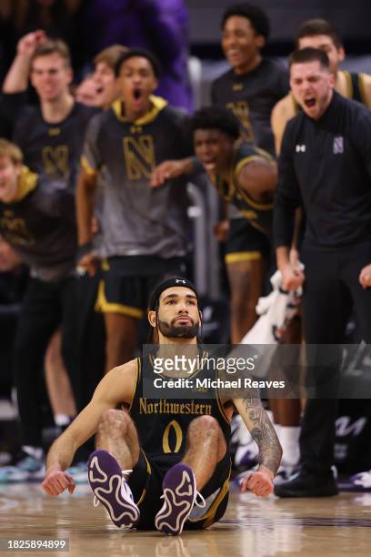 Boo Buie of the Northwestern Wildcats celebrates a basket against the Purdue Boilermakers during the second half at Welsh-Ryan Arena on December 01,...